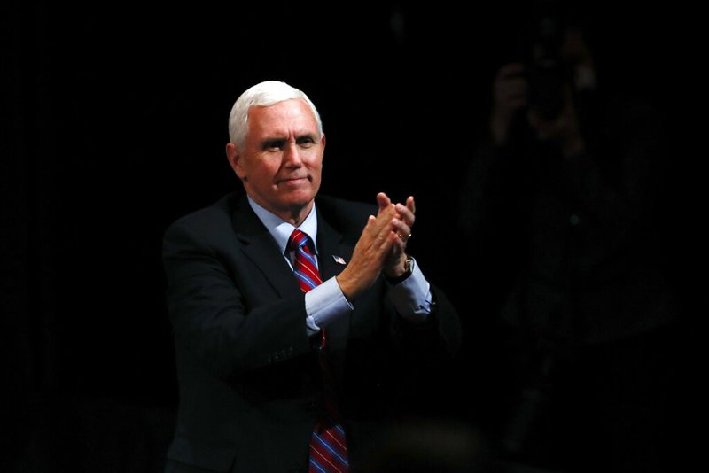 Vice President Mike Pence reacts to audience members after a roundtable with agriculture and food supply leaders on Friday, May 8, 2020, in West Des Moines, Iowa.