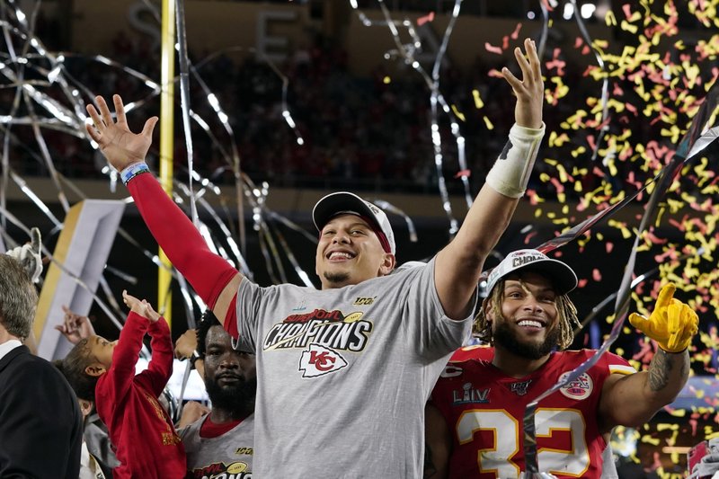 FILE - In this Feb. 2, 2020, file photo, Kansas City Chiefs' Patrick Mahomes, left, and Tyrann Mathieu celebrate after defeating the San Francisco 49ers in the NFL Super Bowl 54 football game in Miami Gardens, Fla. The Kansas City Chiefs began talking about a repeat before they had even left the stadium following their Super Bowl triumph. (AP Photo/David J. Phillip, File) story.lead_photo.caption