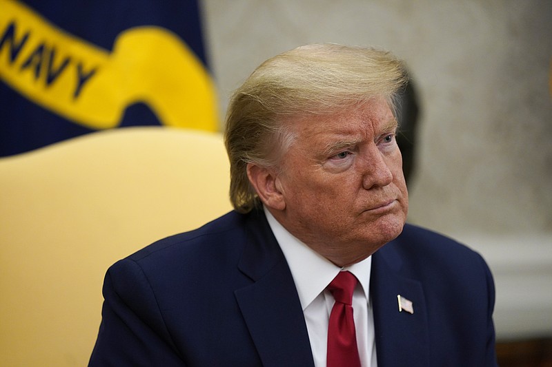 FILE - In this May 7, 2020, file photo President Donald Trump listens during a meeting about the coronavirus response in the Oval Office of the White House in Washington. (AP Photo/Evan Vucci, File)