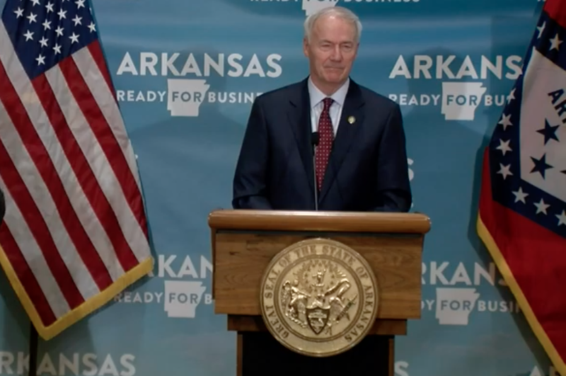 Arkansas Gov. Asa Hutchinson speaks to reporters on Tuesday in Little Rock in this screen grab of video provided by the governor's office. 