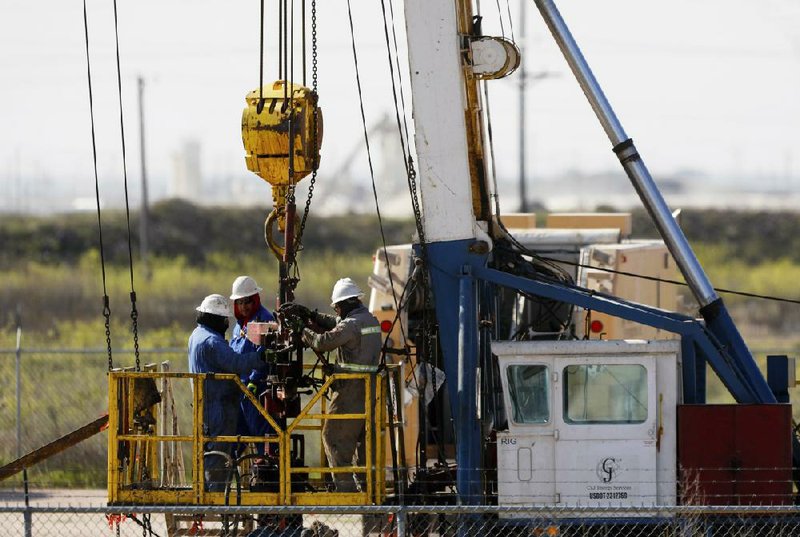 A C&J Energy Services crew works last month outside Odessa, Texas. (Odessa American/Eli Hartman) 
