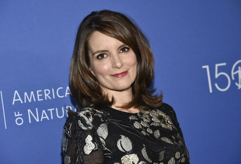 FILE - In this Nov. 21, 2019, file photo, actress Tina Fey attends the American Museum of Natural History's 2019 Museum Gala in New York. Fey says more than $115 million was raised toward supporting New Yorkers impacted by COVID-19 during a virtual telethon. A tearful Fey said “Thank you, thank you" in reaching the dollar amount as host of the Rise Up New York! event Monday, May 11, 2020. (Photo by Evan Agostini/Invision/AP, File)