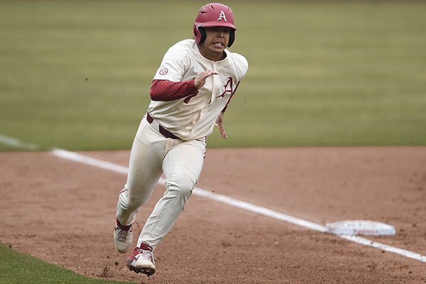 Arkansas catcher Dominic Tamez (7) runs toward home plate during a game against Gonzaga on Sunday, Feb. 23, 2020, in Fayetteville.