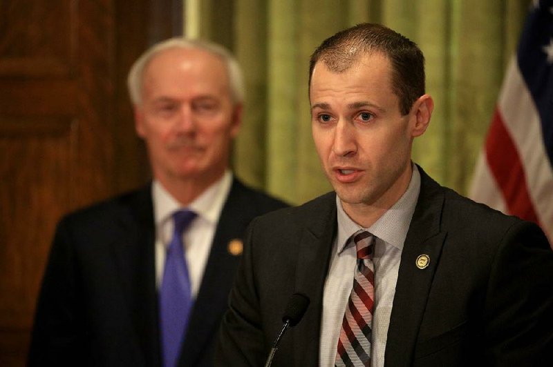 Secretary of Commerce Mike Preston, right, along with Gov. Asa Hutchinson speaks Monday May 4, 2020 during the daily covid-19 briefing at the state Capitol in Little Rock. 
 (Arkansas Democrat-Gazette/Staton Breidenthal)