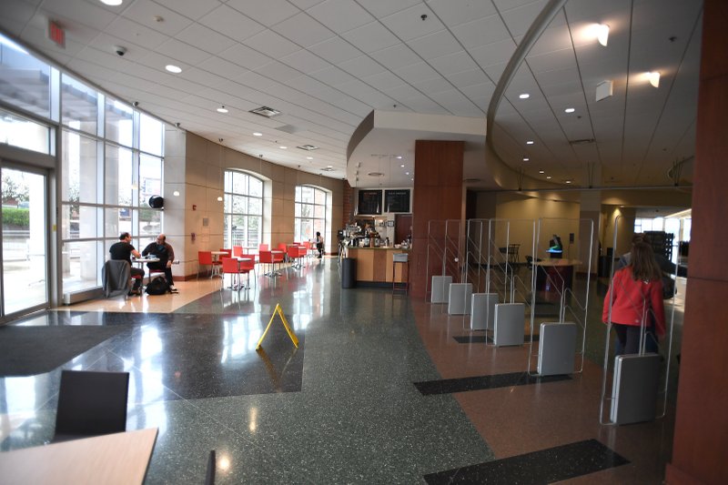 FILE -- A normally bustling lobby is quiet midmorning March 16, 2020 at the Fayetteville Public Library. Libraries across Northwest Arkansas closed to help stop the spread of the coronavirus covid-19. For more information go to www.faylib.org. (NWA Democrat-Gazette/J.T. Wampler)