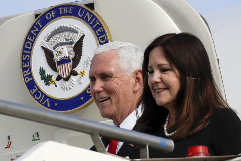 In this Jan. 24, 2020 file photo, Vice President Mike Pence and his wife Karen disembark from Air Force Two upon their arrival at Rome's Ciampino airport. Karen Pence says it's OK to not be OK during the coronavirus pandemic. While Vice President Mike Pence runs the White House coronavirus task force, his wife is leading a parallel effort to help people deal with anxiety and other unsettling emotions brought on by the pandemic.(AP Photo/Alessandra Tarantino)