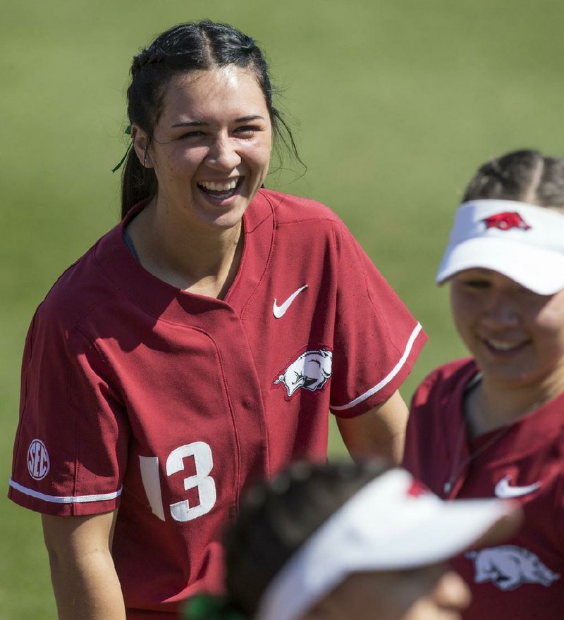 As a teenager, Arkansas catcher Kayla Green served as a parental figure for her two younger siblings while her mother battled substance abuse. (NWA Democrat-Gazette/Ben Goff) 