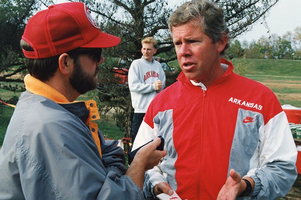 New Arkansas women's track coach Lance Harter speaks to a reporter in 1990.