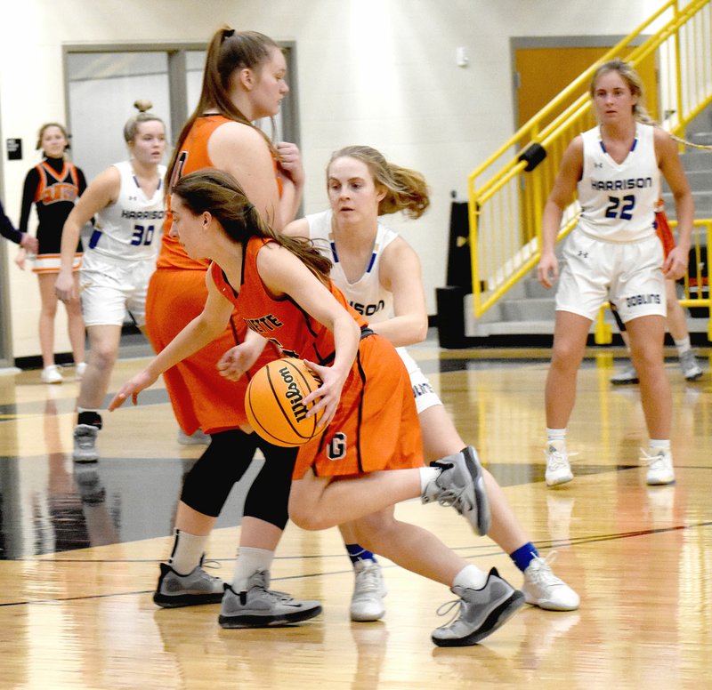 MARK HUMPHREY ENTERPRISE-LEADER Gravette senior Shylee Morrison runs the Harrison defender guarding her through a screen. Morrison scored 14 points before sustaining an injury during a 42-26 loss Gravette experienced on Thursday, Feb. 20, at the District 4A-1 tournament semifinal hosted by Prairie Grove Feb. 17-22. story.lead_photo.caption