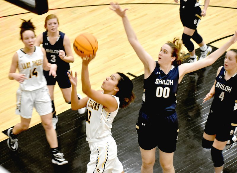 MARK HUMPHREY ENTERPRISE-LEADER Prairie Grove junior Jasmine Wynos shoots a layup during a 53-46 victory over Shiloh Christian on Monday, Feb. 17, during the District 4A-1 girls basketball tournament at Prairie Grove.