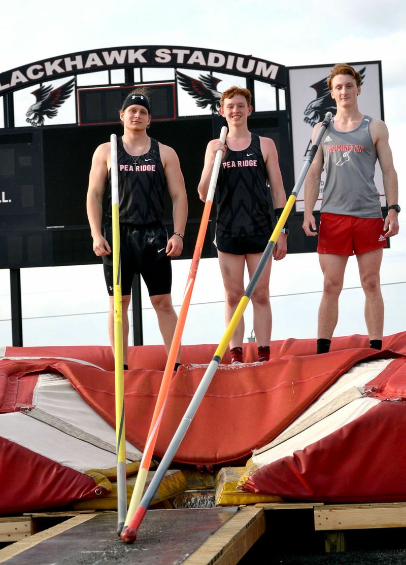 TIMES file photograph by Annette Beard Lance Nunley was one of the three top men's pole vaulters in the 4A-1 District meet in Pea Ridge in May 2019. They are, fom left, Nunley with a third place clearing 11'6"; Zach Woods in second place clearing 13'6"; and Trace South, Farmington, clearing 14'.
