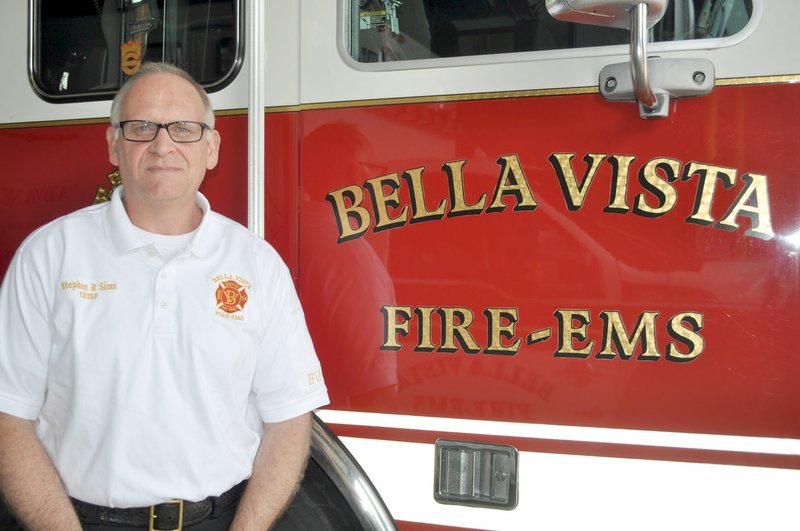 Rachel Dickerson/The Weekly Vista Steve Sims, Bella Vista fire chief, said the department has seen some changes since the covid-19 outbreak began. Paramedics have to put on protective gear when responding to certain medical calls.