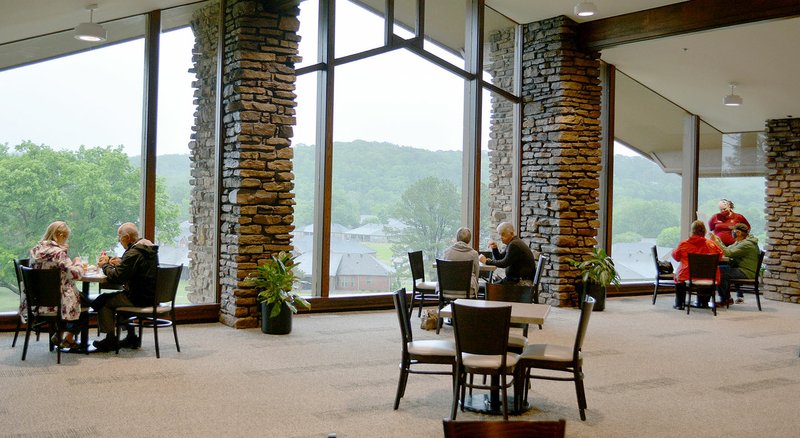 Keith Bryant/The Weekly Vista Diners enjoy lunch and a view while social distancing at BV's Grill at the Country Club. In order to keep diners at a safe distance, some tables have been moved into the Vista Room, in the center of the Country Club.