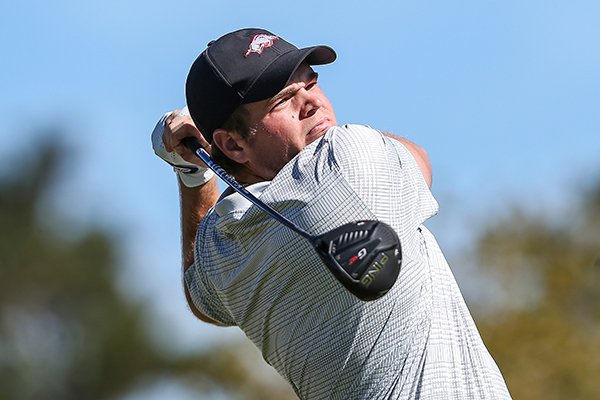 Arkansas golfer Mason Overstreet tees off on the first hole during the first round of an NCAA golf tournament on Monday, Feb. 3, 2020 in Ponte Vedra, Fla. (AP Photo/Gary McCullough)
