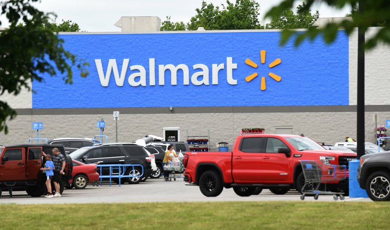 In this file  photo customers enter a Walmart store at 406 S. Walton Blvd. in Bentonville. 
(NWA Democrat-Gazette/Flip Putthoff)