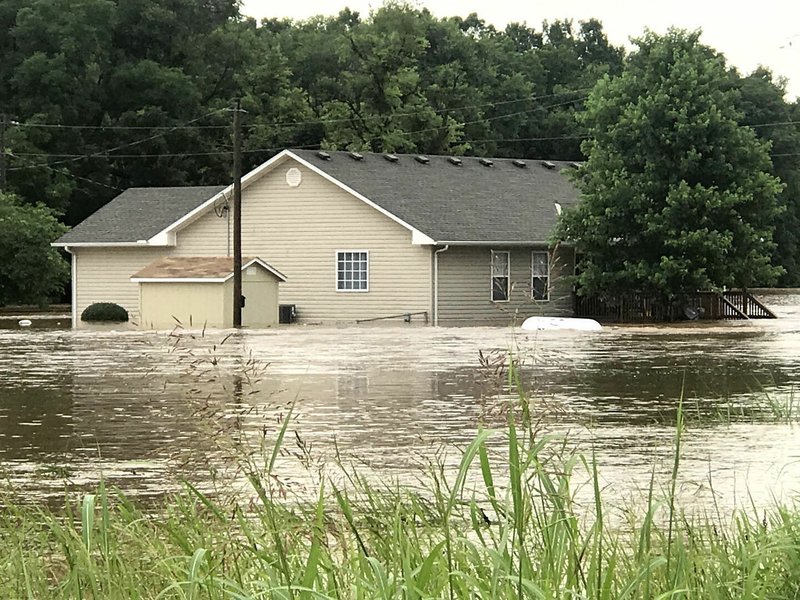 Sally Carroll/McDonald County Press file photo The banks of Indian Creek in Anderson flooded with raging waters last June after heavy rains fell earlier that Sunday morning. Several local agencies recently underwent water-rescue training to navigate swollen rivers and help out McDonald County neighbors in need. Crews recently rescued 11 people over a two-day spurt after spring rains and downed trees in rivers created some hazardous and challenging conditions for canoers and kayakers.