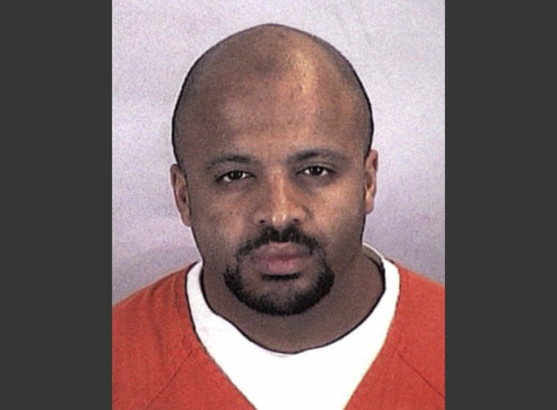 FILE - This undated file photo provided by the Sherburne County Sheriff Office shows Zacarias Moussaoui. Moussaou, the only man ever convicted in a U.S. court for a role in the Sept. 11 attacks now says he is renouncing terrorism, Al-Qaida and the Islamic State.   (Sherburne County, Minn., Sheriff's Office via AP, File)