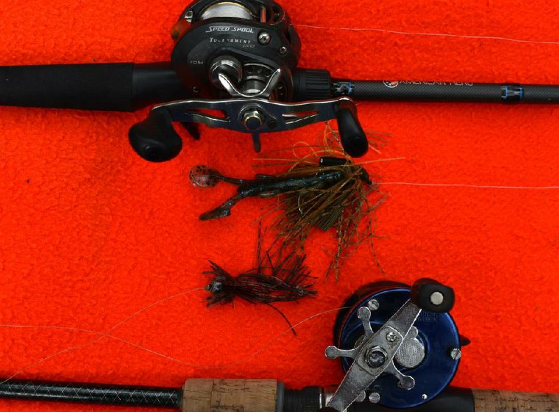 The standard bass jig is a chunk of lead molded to a hook with a rubber skirt. Adding a soft plastic trailer enhances the appearance. The top jig also has a rattle to produce sound. These are best suited for stout rods with fast bait casting reels.
(Arkansas Democrat-Gazette/Bryan Hendricks)