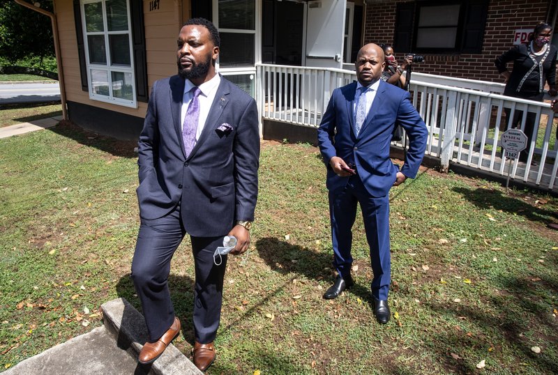Lee Merritt, left, and Chris Stewart, attorneys for the mother of Ahmaud Arbery, are seen at a news conference on Wednesday in East Point, Georgia. The attorneys appeared and spoke at a news conference held by the Atlanta branch of the NAACP. After a video of the shooting of Arbery emerged on social media, the Georgia Bureau of Investigation, arrested Gregory McMichael, 64, and his son, Travis McMichael, 34, and they were jailed on murder and aggravated assault charges. - AP Photo/Ron Harris story.lead_photo.caption