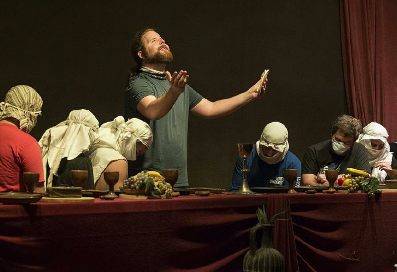 J.P. Dean (center), portraying Jesus, gathers the Apostles for the Last Supper during rehearsal Tuesday in Eureka Springs for The Great Passion Play. More photos at arkansasonline.com/522passionplay/.
(NWA Democrat-Gazette/Ben Goff)