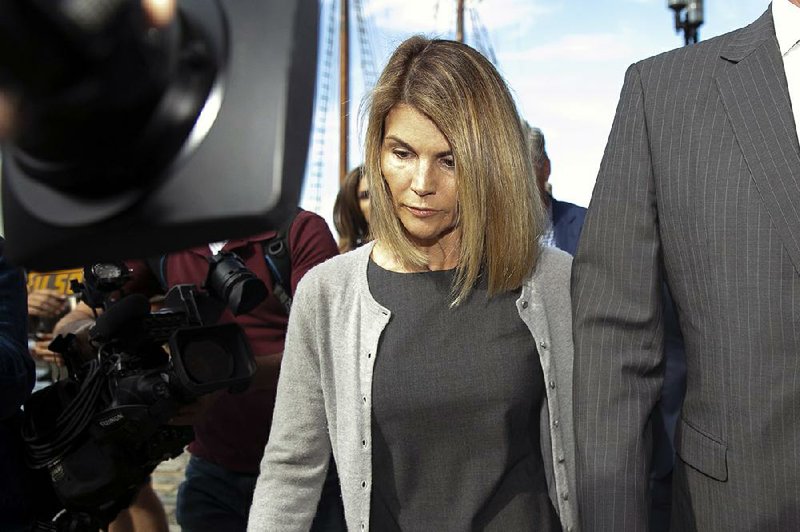 Lori Loughlin, the actor, leaves federal court in Boston on Aug. 27, 2019. 
(Katherine Taylor/The New York Times)