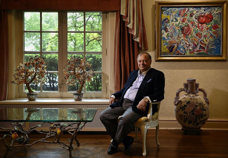 In this May 17, 2016, file photo, Farhad Azima, the owner, chairman and chief executive officer of Kansas City-based Aviation Leasing Group sits at his home in Kansas City, Mo. An Iranian-American aviation magnate and gunrunner tied to the CIA and the Iran-Contra scandal must pay a sheikhdom in the United Arab Emirates over $4.1 million over a series of business disputes, a British court ruled Friday, May 22, 2020. - Jill Toyoshiba/The Kansas City Star via AP, File