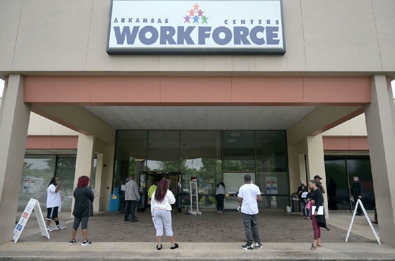 People wait in line to file for unemployment Friday, May 22, 2020, at the Little Rock office of the state Division of Workforce Services.  (Arkansas Democrat-Gazette/Stephen Swofford)