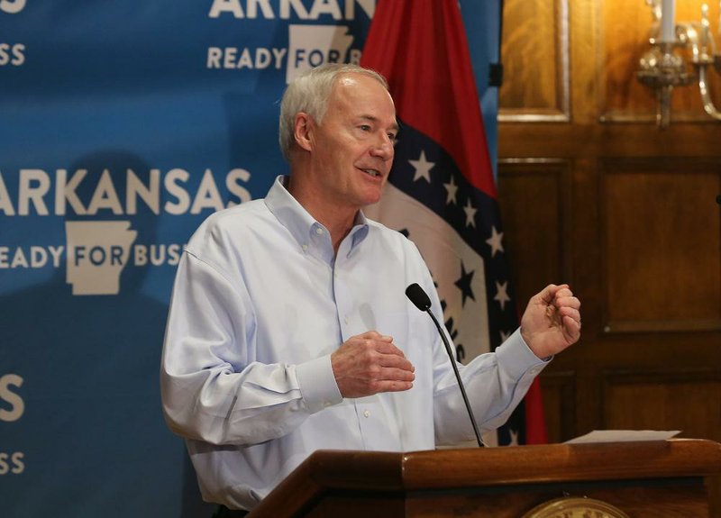 Gov. Asa Hutchinson gives the breakdown of new cases of covid-19 during the daily covid-19 briefing on Saturday, May 23, 2020, at the state Capitol in Little Rock. 
(Arkansas Democrat-Gazette/Thomas Metthe)