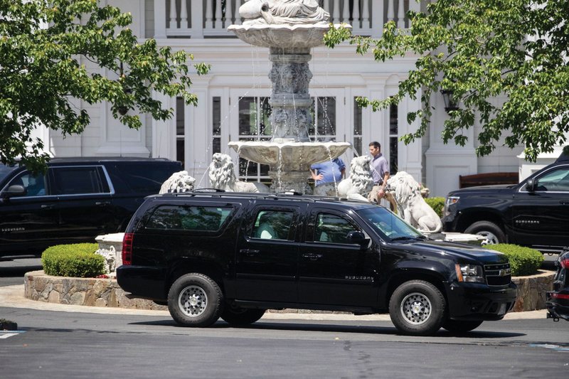 President Donald Trump’s motorcade leaves Trump National Golf Club in Sterling, Va., on Saturday. Some religious leaders have criticized Trump’s declaration that houses of worship are “essential” and should resume in-person services this weekend.
(AP/Alex Brandon)