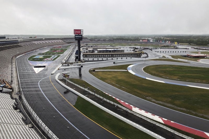 Charlotte Motor Speedway is shown in Concord, N.C., Wednesday, May 20, 2020. Some fans have been coming to the Coca-Cola 600 for decades, but they won&#x2019;t be allowed into Charlotte Motor Speedwa&#xfd; on Sunday due to Covid-19, leaving the grandstands empty and many disappointed. (AP Photo/Steve Reed)