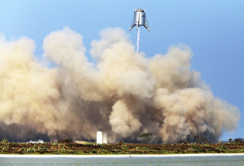 In this Aug. 27, 2019, file photo, SpaceX tests their StarHopper, successfully hovering 500 feet above the launch site and safely landing at the company's facility in Brownsville, Texas. - Miguel Roberts/The Brownsville Herald via AP