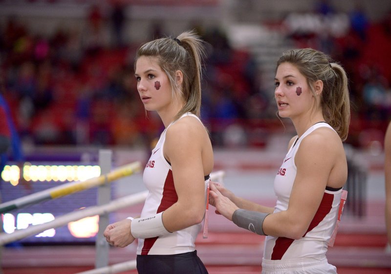 Tori Hoggard, left, and Lexi Jacobus of Arkansas, shown competing for Arkansas in 2016, completed their careers at Arkansas with a combined five NCAA and seven Southeastern Conference titles. The two pole vaulters plan to train for the Olympics in Tokyo next summer while attending pharmacy school at the University of Arkansas for Medical Sciences. - Photo by Ben Goff of NWA Democrat-Gazette