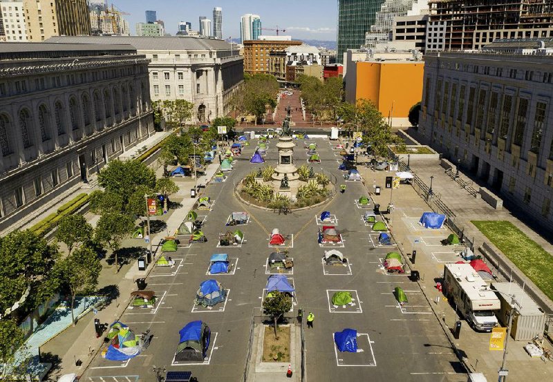 Rectangular markings encourage social distancing at a city-sanctioned homeless encampment at the Civic Center of San Francisco.
(AP/Noah Berger)