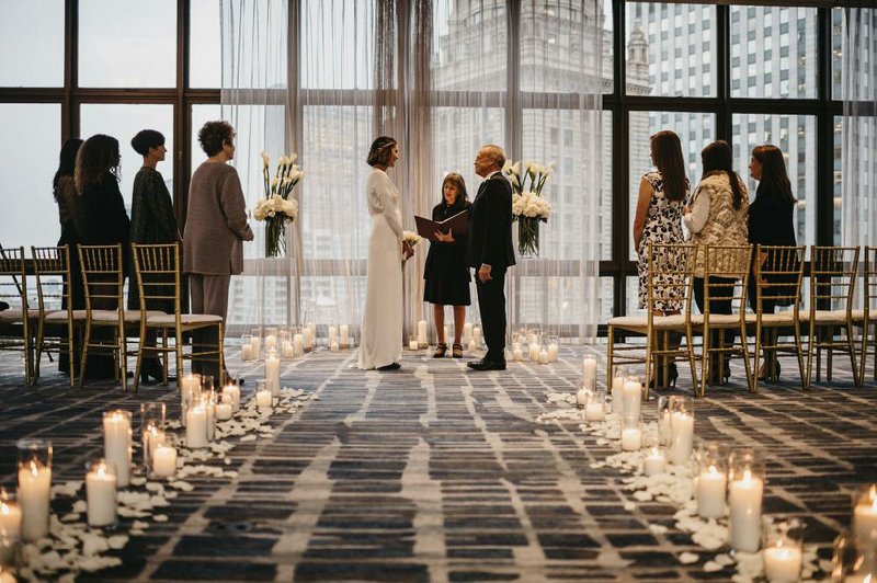 Couples turn to ‘minimonies’ to salvage weddings 
This photo released by Erin Elliott shows the wedding of Melissa Todd and Jeffrey Hall in November in Chicago. The couple had seven guests, feeding a trend toward micro weddings that has grown stronger since the coronavirus pandemic sent millions into isolation. (AP/Erin Elliott) 