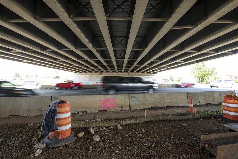 Vehicles pass under the new Interstate 49 bridge Wednesday at the site of the new interchange at Exit 85 for West Walnut Street in Rogers and South Walton Boulevard in Bentonville. Go to nwaonline.com/200525Daily/ to see more photos. (NWA Democrat-Gazette/Ben Goff)