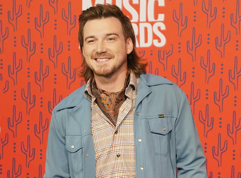 FILE - In this June 5, 2019, file photo, Morgan Wallen arrives at the CMT Music Awards on at the Bridgestone Arena in Nashville, Tenn. Country music singer Wallen has apologized following his weekend arrest on public intoxication and disorderly conduct charges. News outlets report the 27-year-old Wallen was arrested Saturday, May 23, 2020, after he was kicked out of Kid Rock's bar in downtown Nashville. (AP Photo/Sanford Myers, File)