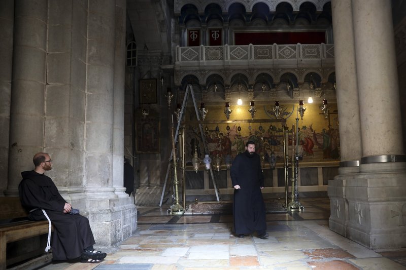 Entry to the Church of the Holy Sepulcher in Jerusalem’s Old City was limited to 50 people at a time Sunday.
(AP/Mahmoud Illean)