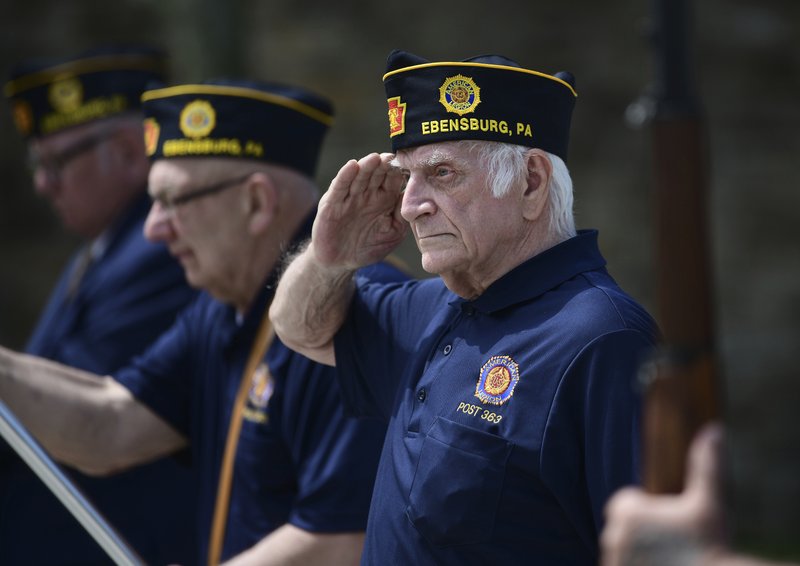 US Army veteran Joseph Lesniak of Colver, Pa., salutes during the playing of Taps at a Memorial Day ceremony at Soldiers and Sailors Memorial Park, in Ebensburg, Pa., Monday, May 25. 2020. (John Rucosky/The Tribune-Democrat via AP)