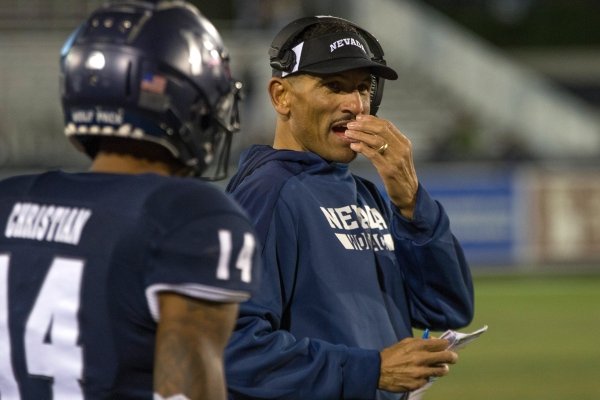 Nevada head coach Jay Norvell talks with wide receiver Dominic Christian on the sidelines against Hawaii during the second half of an NCAA college football game in Reno, Nev., Saturday, Sept. 28, 2019. (AP Photo/Tom R. Smedes)