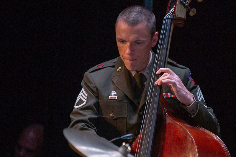 Staff Sgt. Hamilton Price, a Jonesboro native, plays his double bass during a performance with the U.S. Army Field Band. The elite band will show a virtual concert today on its website, army- eldband.com. 
(Special to the Democrat-Gazette) 
