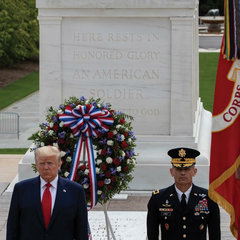 President Donald Trump stands at the Tomb of the Unknown Soldier at Arlington National Cemetery in Virginia after placing a wreath in honor of Memorial Day. More photos at arkansasonline.com/ 526covid/. (AP/Alex Brandon) 