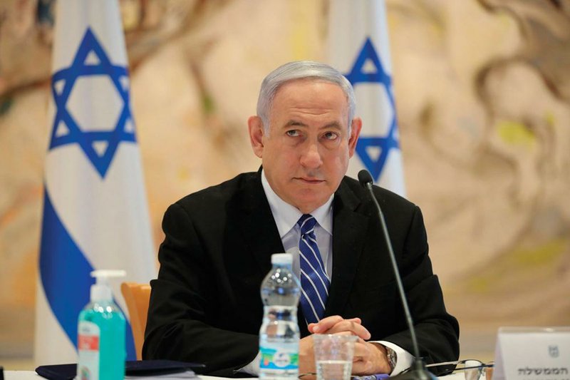 Israeli Prime Minister Benjamin Netanyahu attends the first Cab- inet meeting of his new government Sunday in Jerusalem. His coalition deal includes a clause that allows him to present his annexation plan to the government in July. 
(AP/Abir Sultan) 