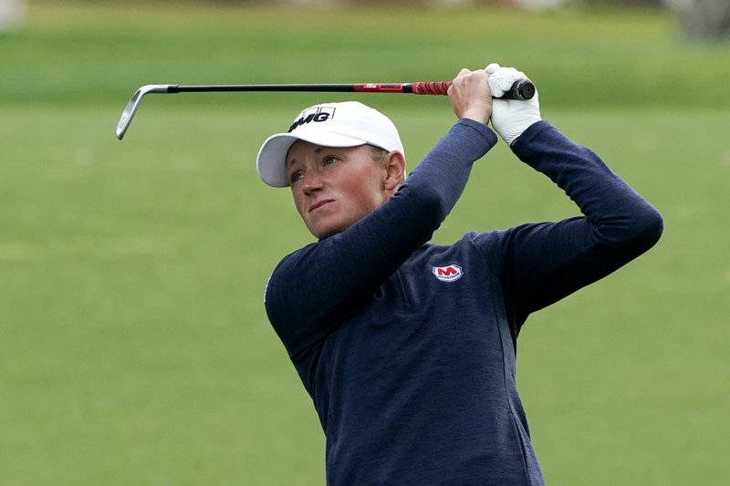 Stacy Lewis hits from the fairway on the first hole during the first round of the LPGA Tour ANA Inspiration golf tournament at Mission Hills Country Club on April 4, 2019, in Rancho Mirage, Calif. Lewis has taken advantage of the LPGA Tour's downtime over the past few months to improve areas of her game, using the practice facilities at the University of Houston, which have been off limits to the school's players. - Photo by Chris Carlson of The Associated Press