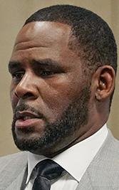 FILE - In this June 6, 2019, file photo, singer R. Kelly pleaded not guilty to 11 additional sex-related felonies during a court hearing before Judge Lawrence Flood at Leighton Criminal Court Building in Chicago. R&B singer R. Kelly is due in federal court to enter a plea to an updated federal indictment that includes sex abuse allegations involving a new accuser. †The 53-year-old is expected to plead not guilty at a hearing Thursday, March 5, 2020, in Chicago to a superseding indictment unsealed last month that includes multiple counts of child pornography. (E. Jason Wambsgans/Chicago Tribune via AP, Pool, File)