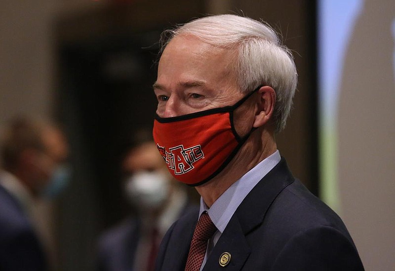 Gov. Asa Hutchinson, wearing an Arkansas State University mask listens to a question after the daily covid-19 briefing on Wednesday, May 27, 2020, at the Red Wolf Convention Center in Jonesboro. 
(Arkansas Democrat-Gazette/Thomas Metthe)