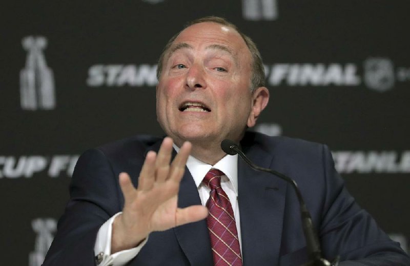 NHL Commissioner Gary Bettman announced Tuesday that the league will begin its postseason with 24 teams, instead of the normal 16, if it is able to resume play. (AP file photo) 
