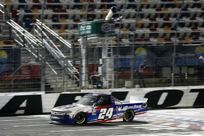 Chase Elliott won Tuesday’s NASCAR Truck Series race at Char- lotte Motor Speedway by 0.627 seconds over Kyle Busch. (AP/Gerry Broome) 