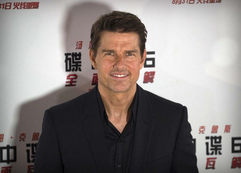  In this Aug. 29, 2018 file photo, Tom Cruise poses for photos during a red carpet event for the movie "Mission: Impossible - Fallout" at the Imperial Ancestral Temple in Beijing, China. 
(AP Photo/Mark Schiefelbein)