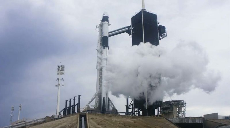The Falcon 9 rocket vents liquid oxygen Wednesday as it prepares for launch from Cape Canaveral, Fla., moments before its mission was aborted because of bad weather.
(AP/SpaceX)