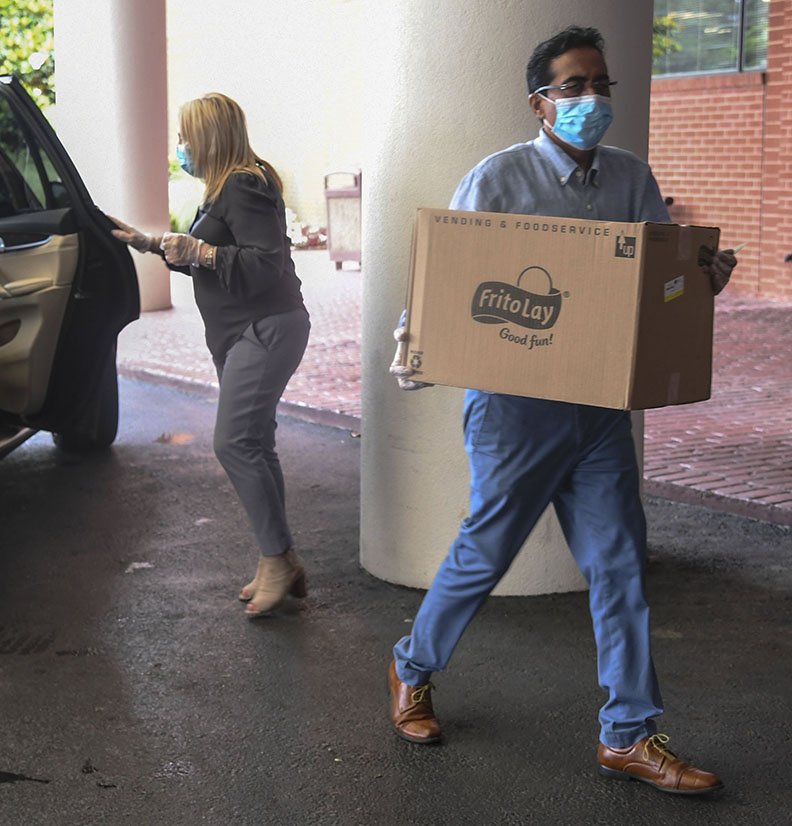 Rajesh Mehta, owner of Mehta Hospitality, delivers lunches from The DoubleTree by Hilton Hot Springs to the staff of National Park Medical Center on Thursday. - Photo by Grace Brown of The Sentinel-Record